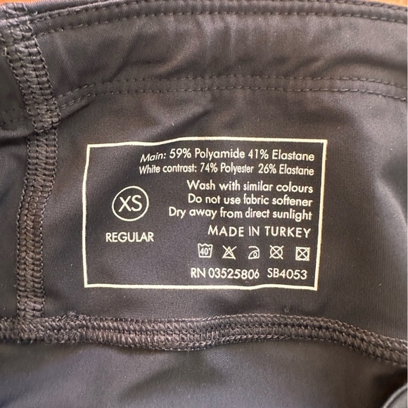 Sweaty Betty Black Leggings with Orange and White Accents - Picture 8 of 8